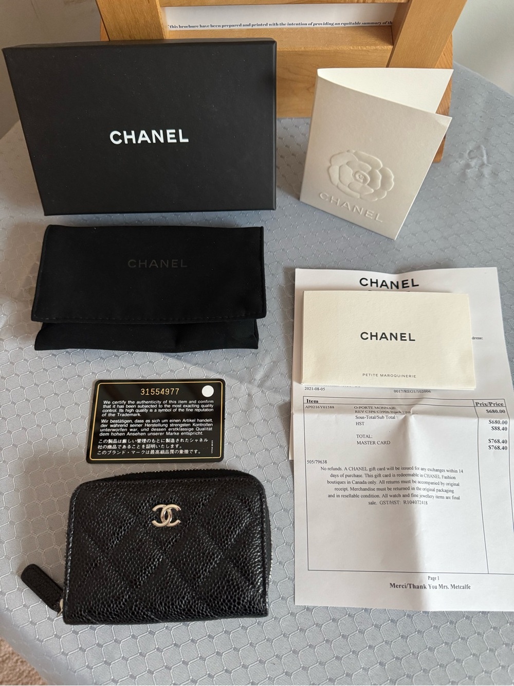 CHANEL Black Quilted Zip-Around Card Case with Silver CC